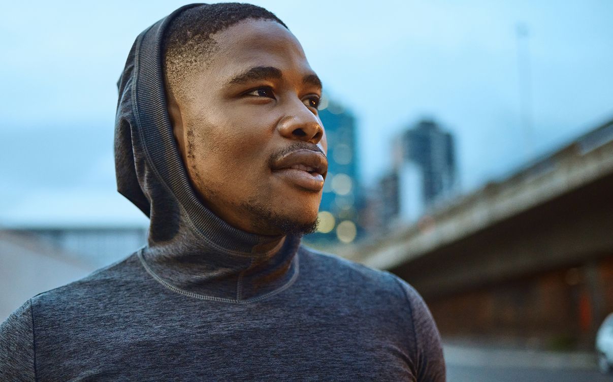 Hyperbaric Oxygen Therapy model gazing thoughtfully in urban setting.